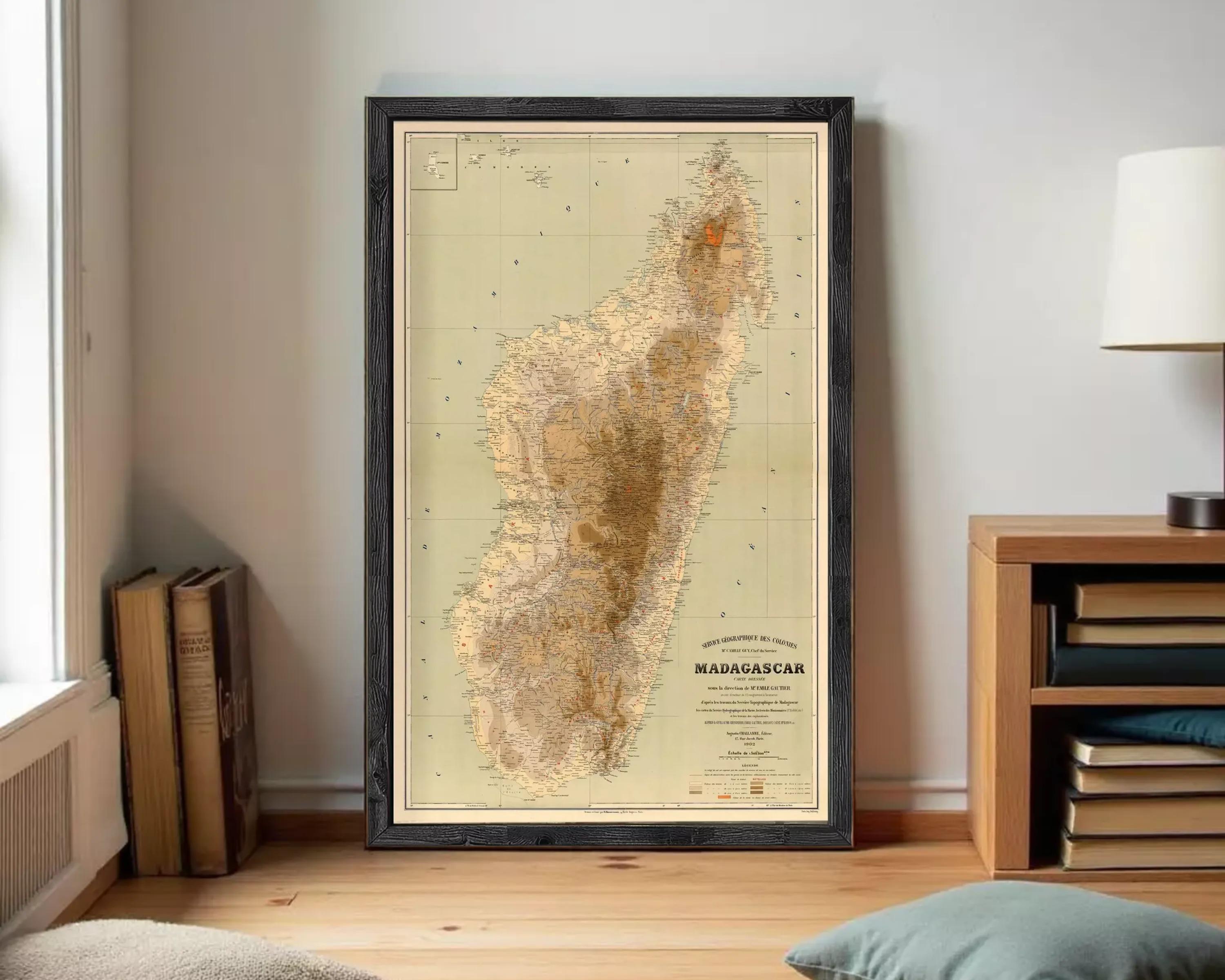 The image is a framed map of Madagascar, a country in the South Pacific, with a vintage style and a beige color scheme.