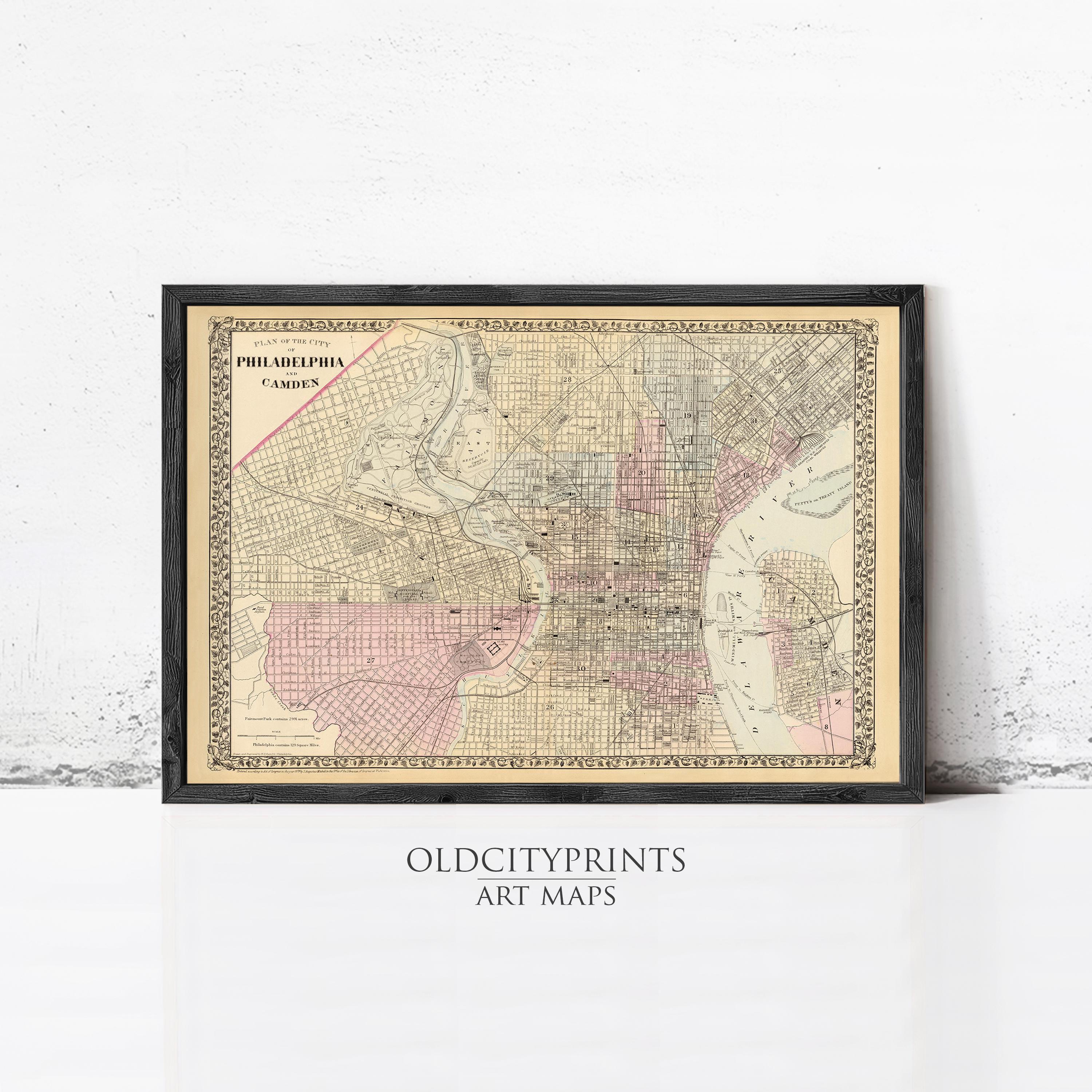 The image is a framed vintage map of Philadelphia, Pennsylvania, depicting the city's streets and neighborhoods.