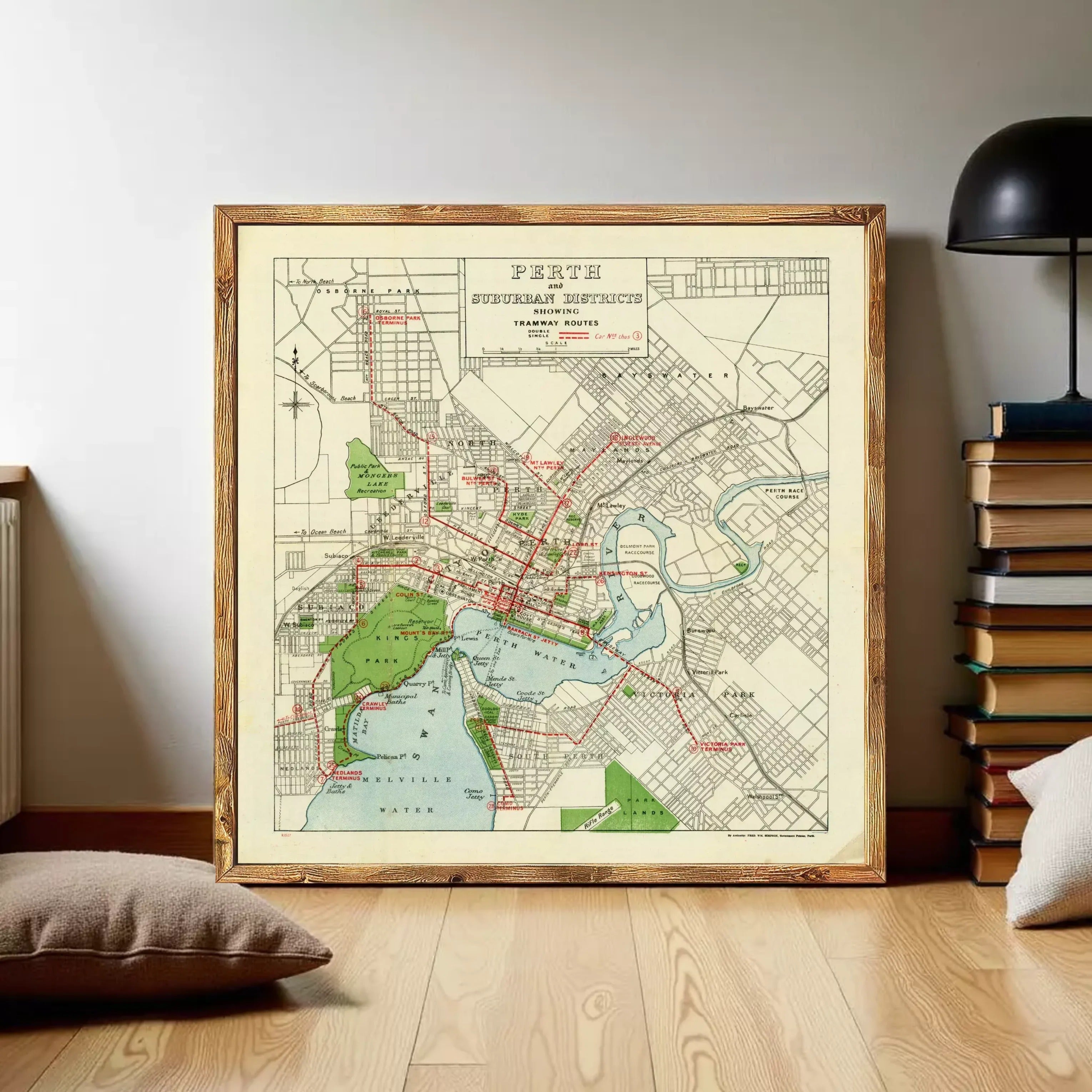 The image is a framed vintage map of the city of Perth, Australia, depicting the city's streets, parks, and other landmarks.