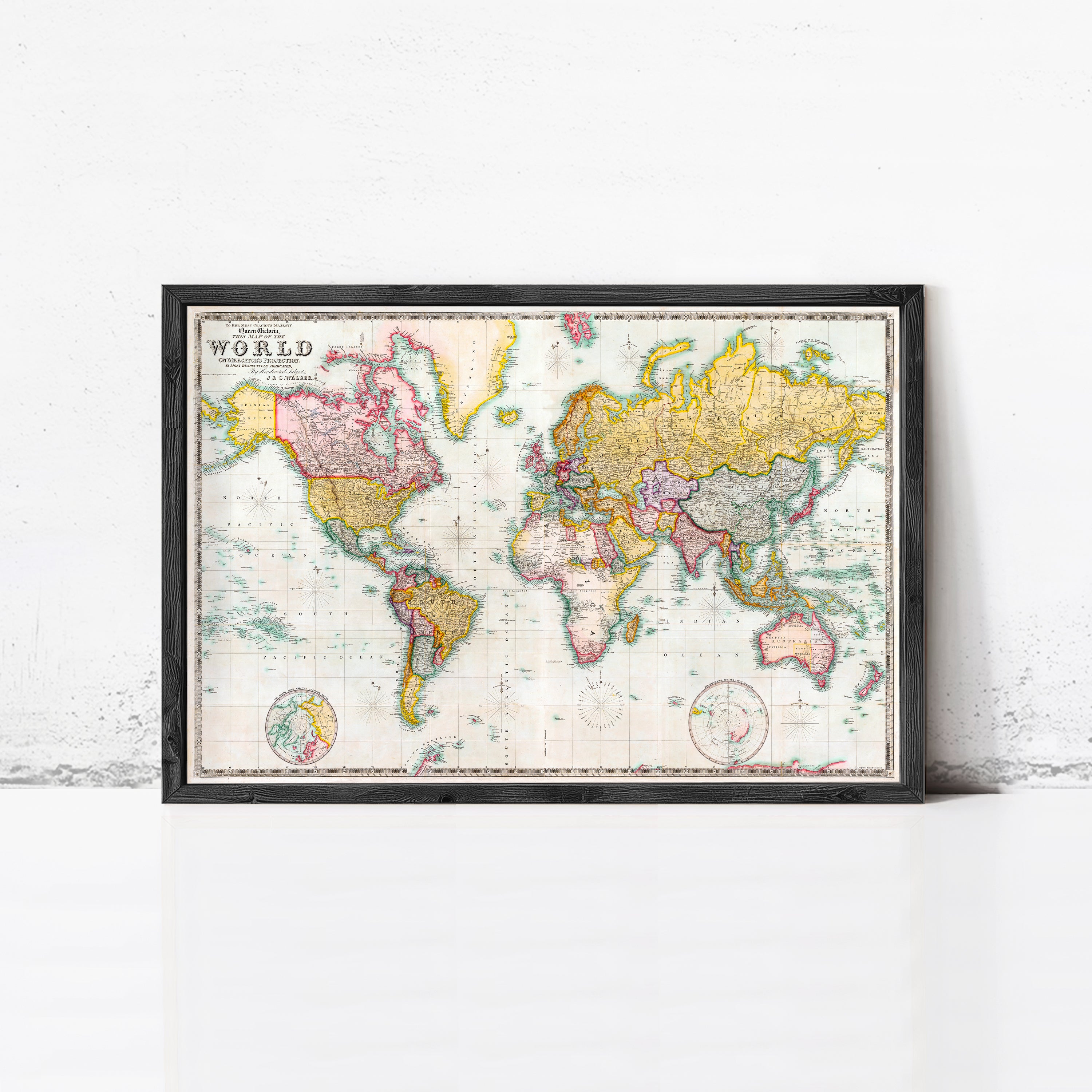 The image is a framed vintage world map with colorful borders and detailed country borders.