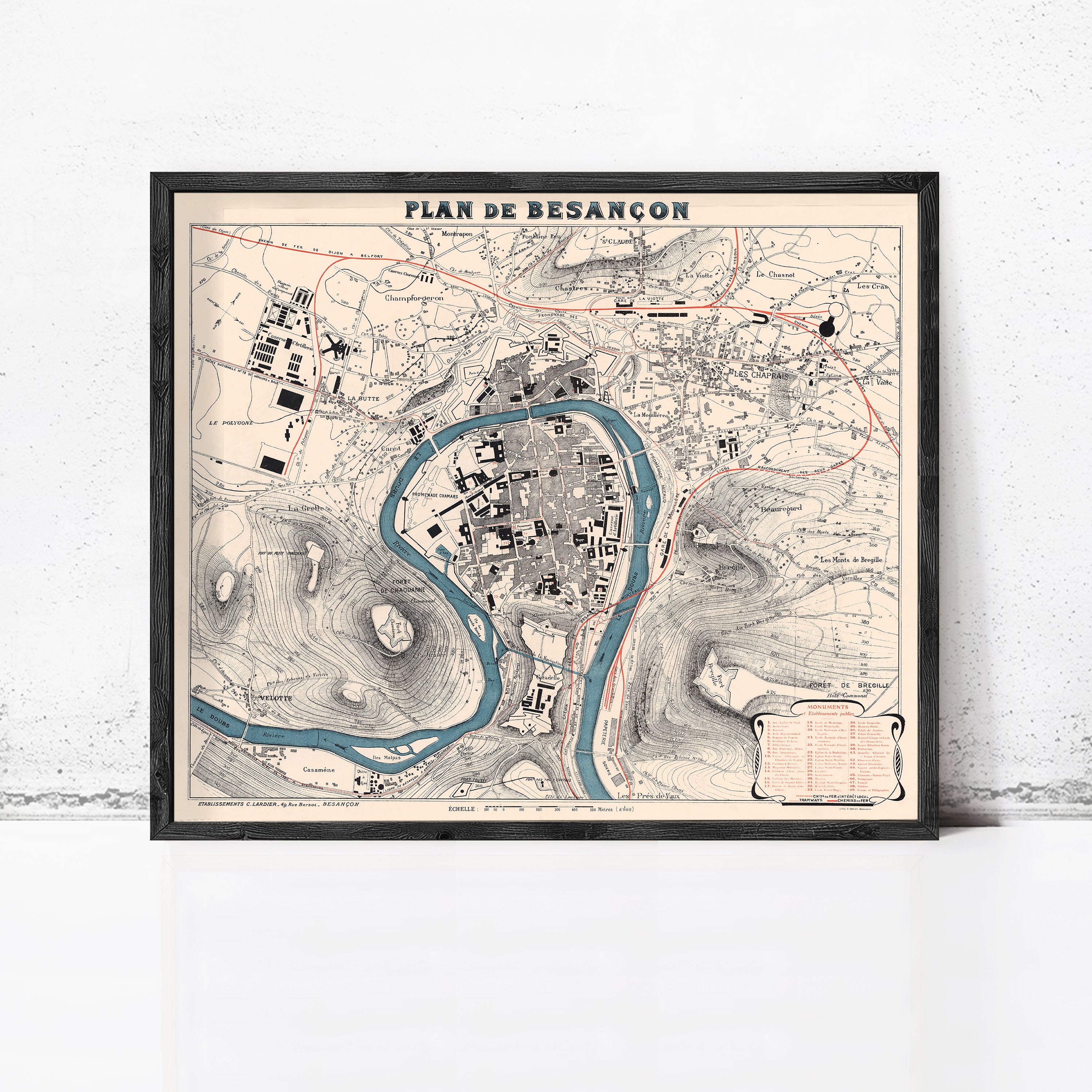The image is a framed vintage map of the city of Besancón, depicting the city's layout and surrounding areas.