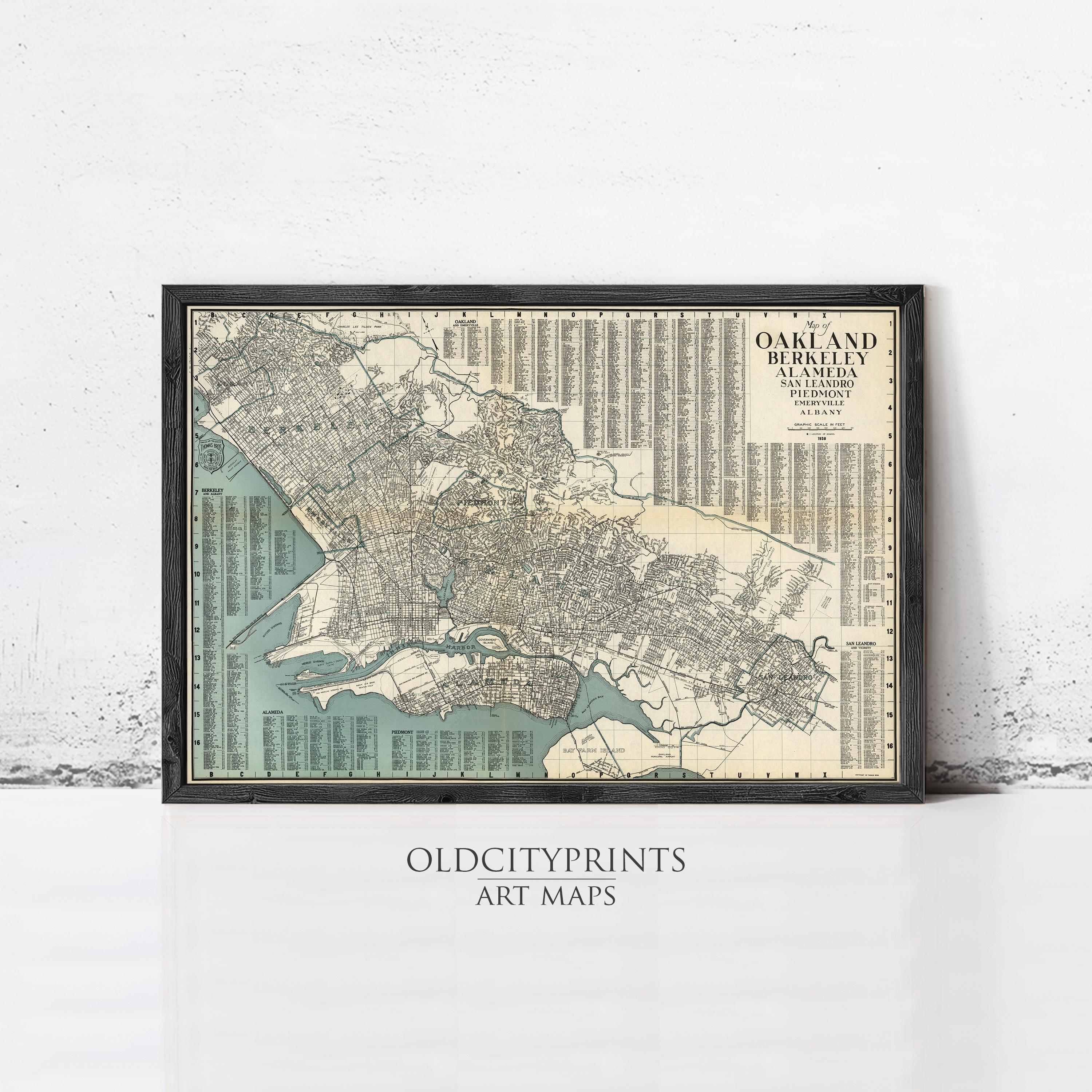 The image is a framed vintage map of Oakland, California, with a black border and a beige background.