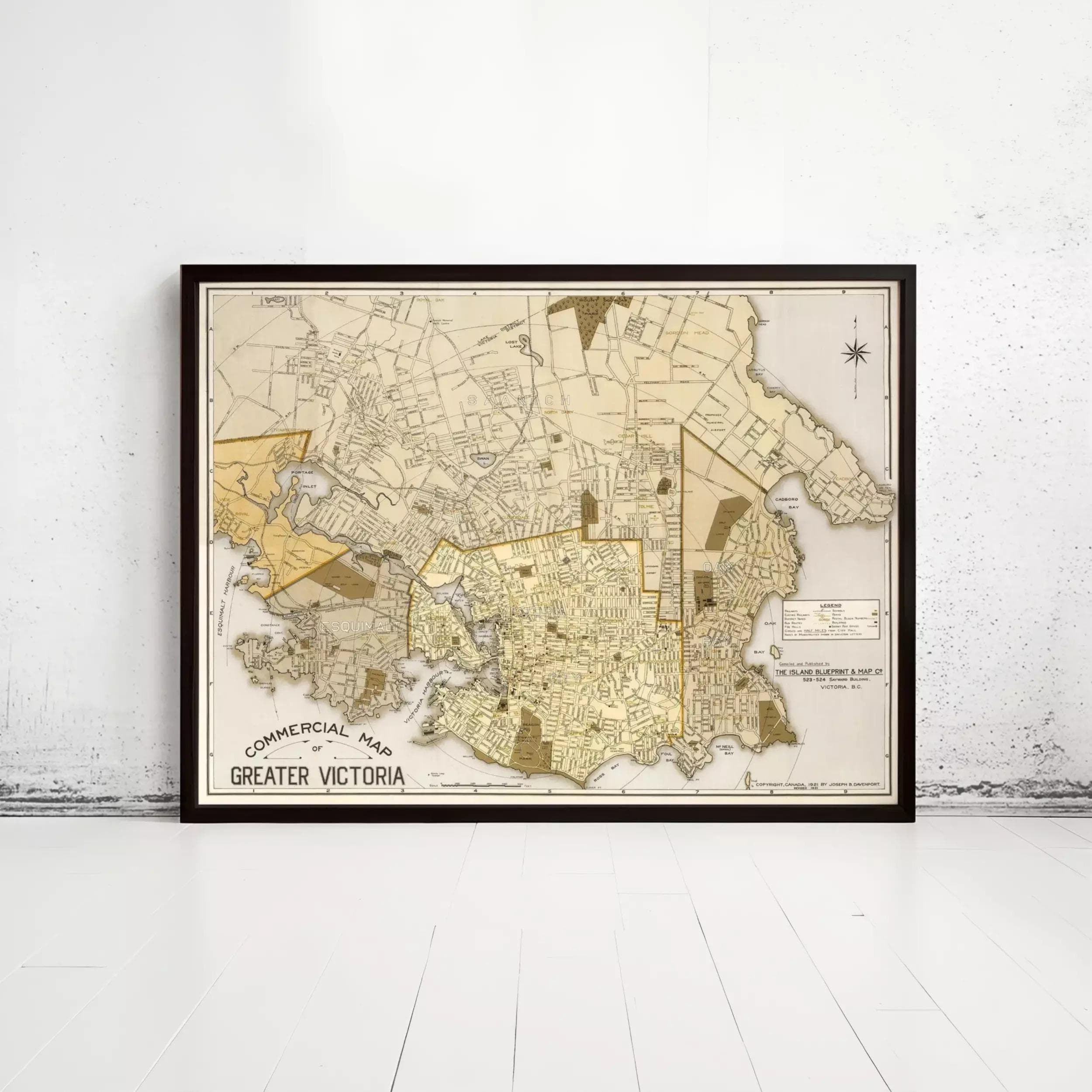 The image is a framed vintage map of Greater Victoria, Australia, depicting the city's streets and surrounding areas.