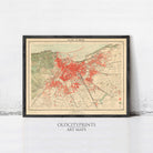 The image is a framed vintage map of a city, with a red dot representing a specific location or point of interest.