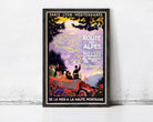A framed vintage travel poster advertising a tour of the route to the Alps, featuring a car and people traveling through a scenic landscape.