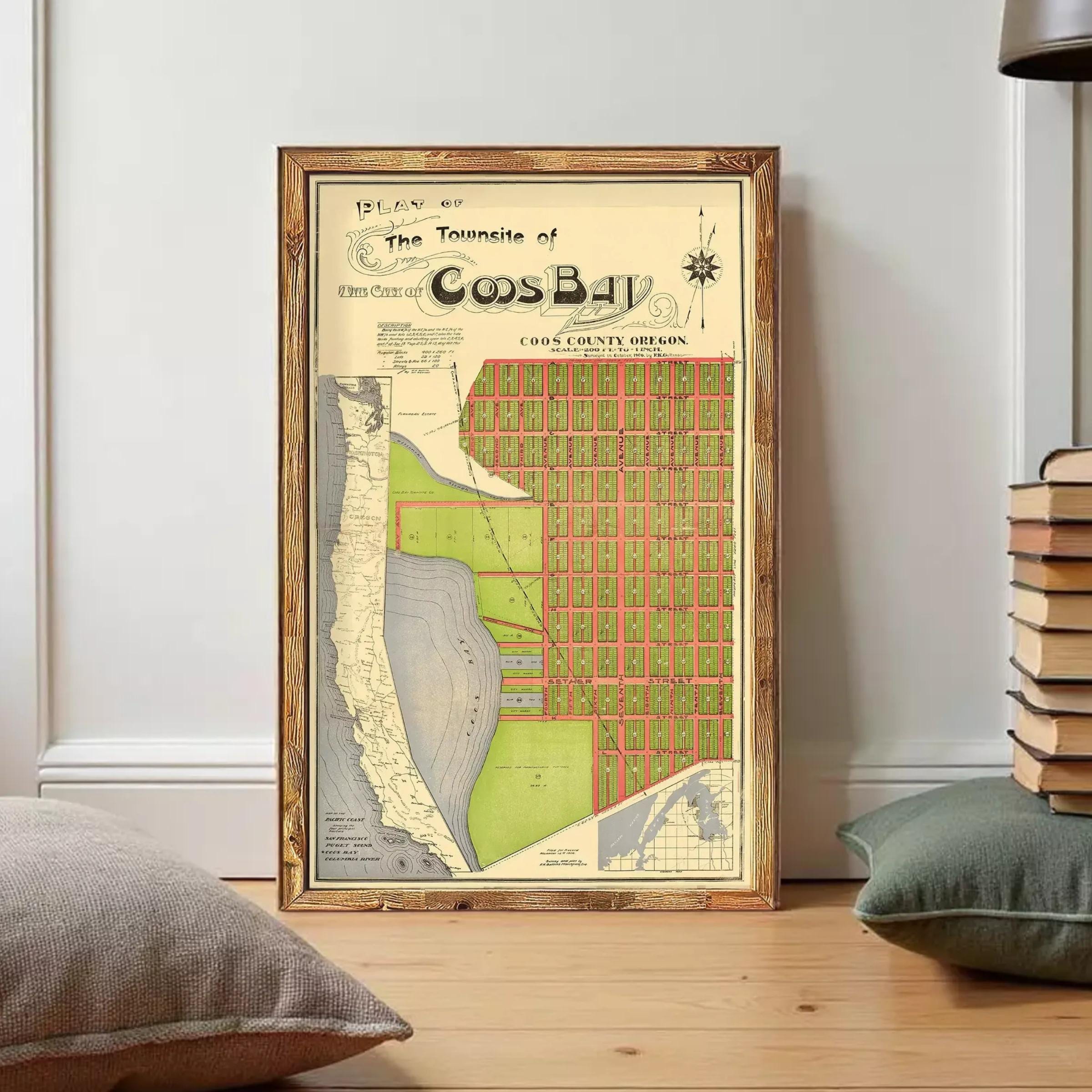 The image is a framed vintage map of the Town of Cos Bay, Oregon, depicting a detailed layout of the area.