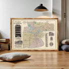The image is a framed vintage map of a city, likely from the early 20th century, depicting various buildings and streets.