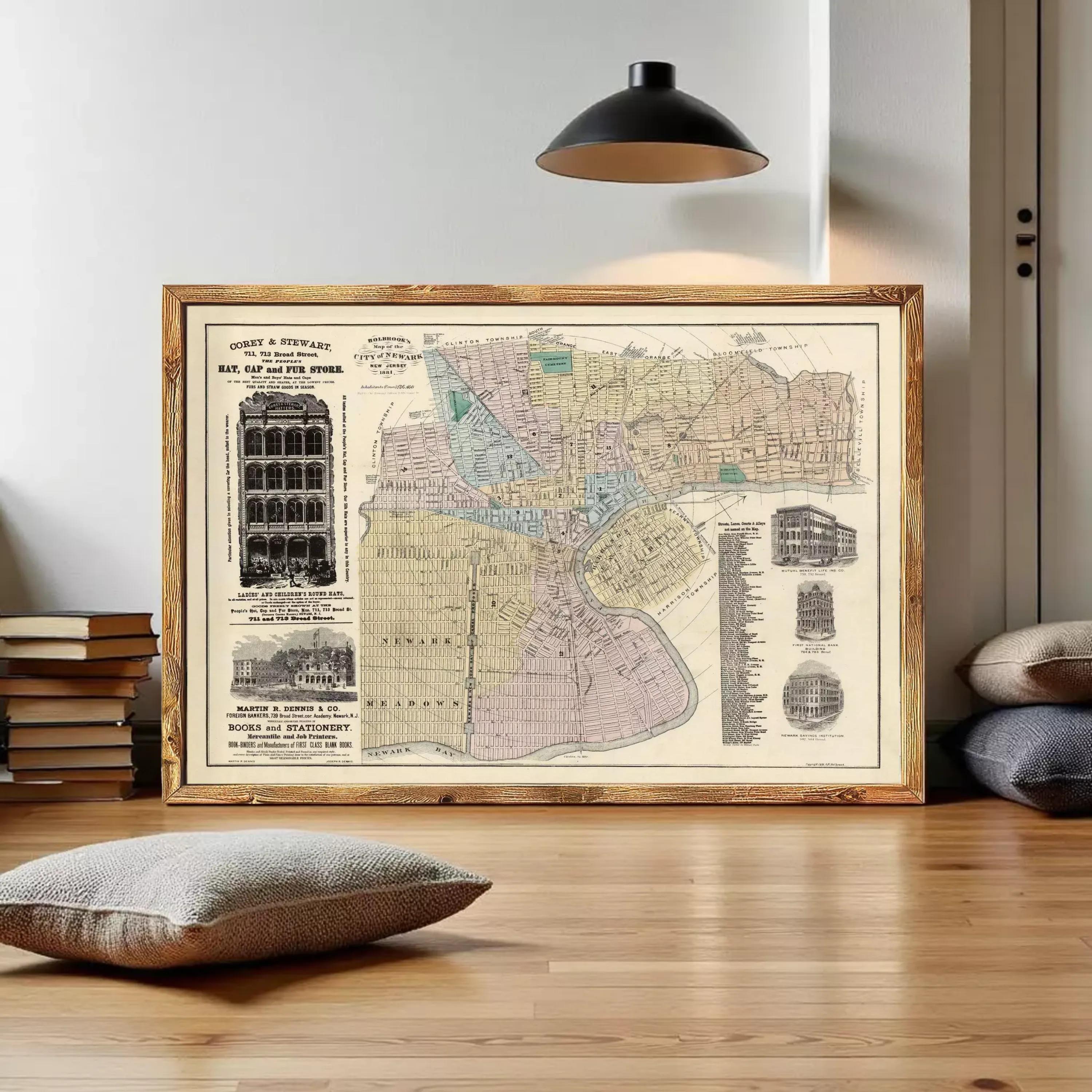 The image is a framed vintage map of a city, likely from the early 20th century, depicting various buildings and streets.