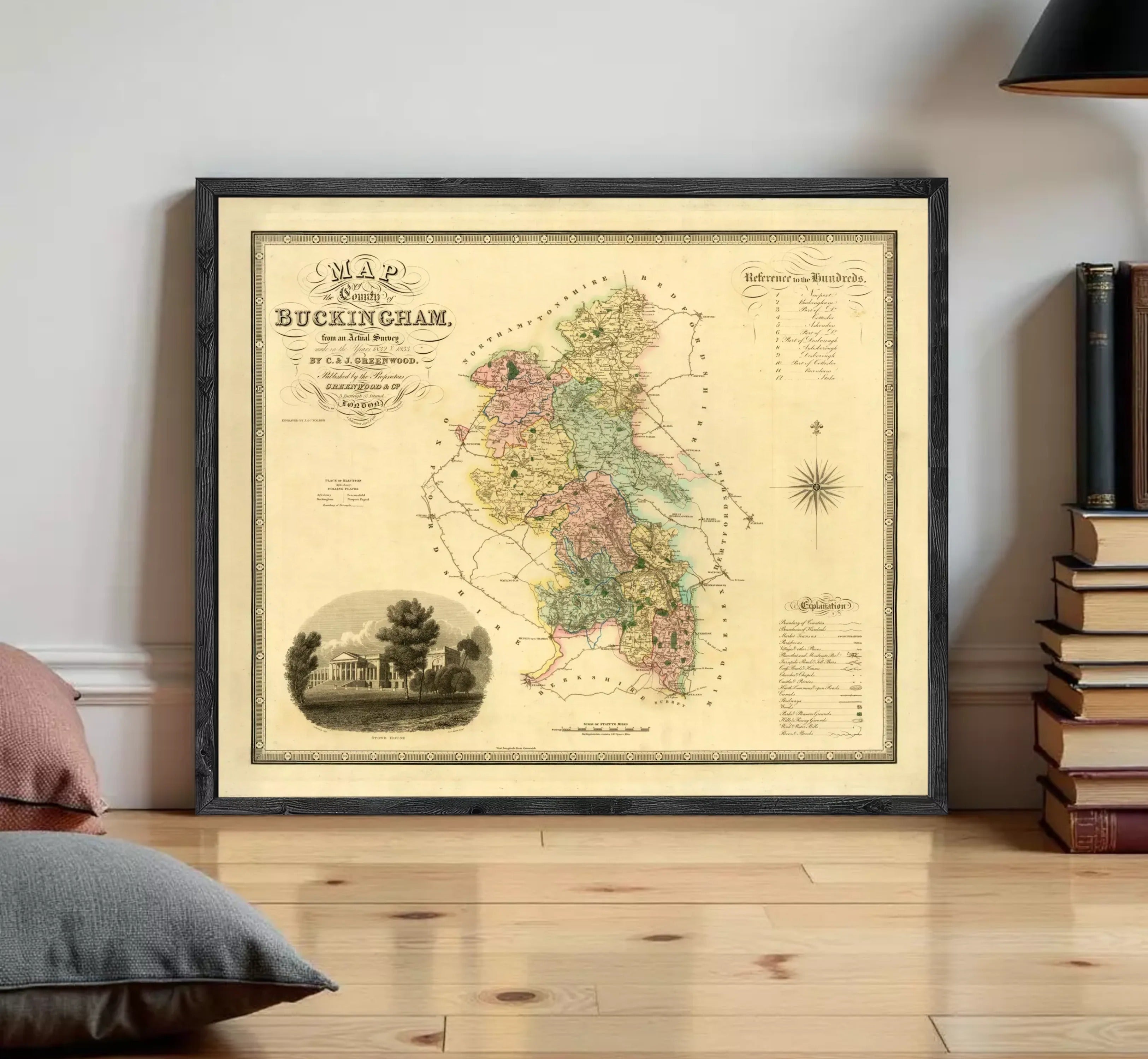 The image is a framed antique map of the city of Buckingham, England, depicting a detailed and colorful representation of the area.