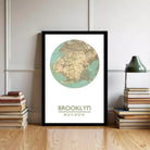 A framed map of Brooklyn, New York, with the text "BROOKLYN" and the coordinates "40°37'37" 37'57" W" below the map.