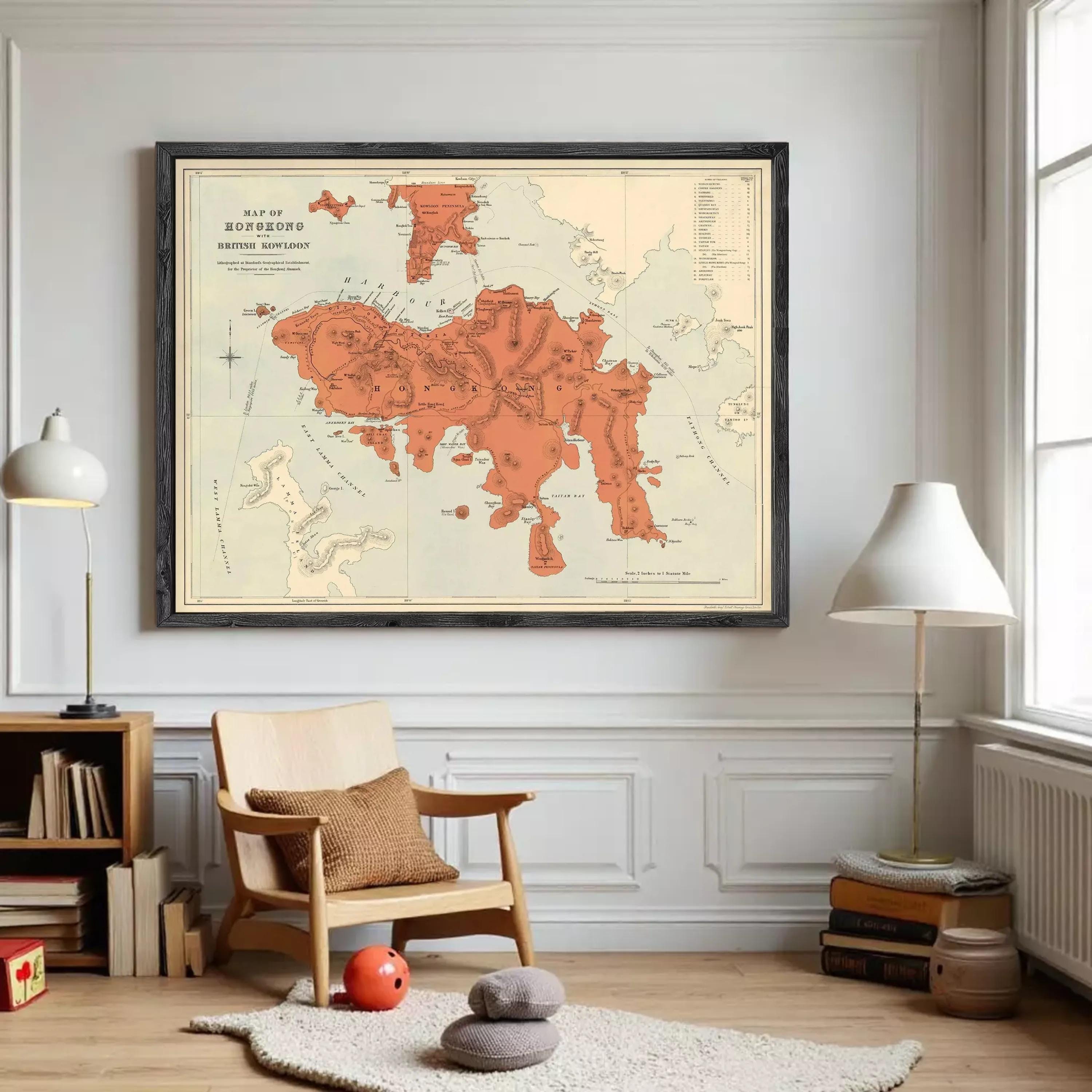 The image is a framed vintage map of Hong Kong, depicting the island and surrounding areas in a detailed and colorful manner.