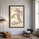 A framed vintage map of Italy, depicting the country in a detailed and colorful manner.