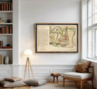 The image is a framed historical map of a city, likely from the 17th century, with detailed illustrations and labels.