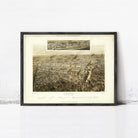 The image is a framed print of a large aerial view of a city, depicting a densely populated urban landscape with numerous buildings and streets.