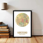 A framed map of Hartford, Connecticut, with the city's name and coordinates displayed.