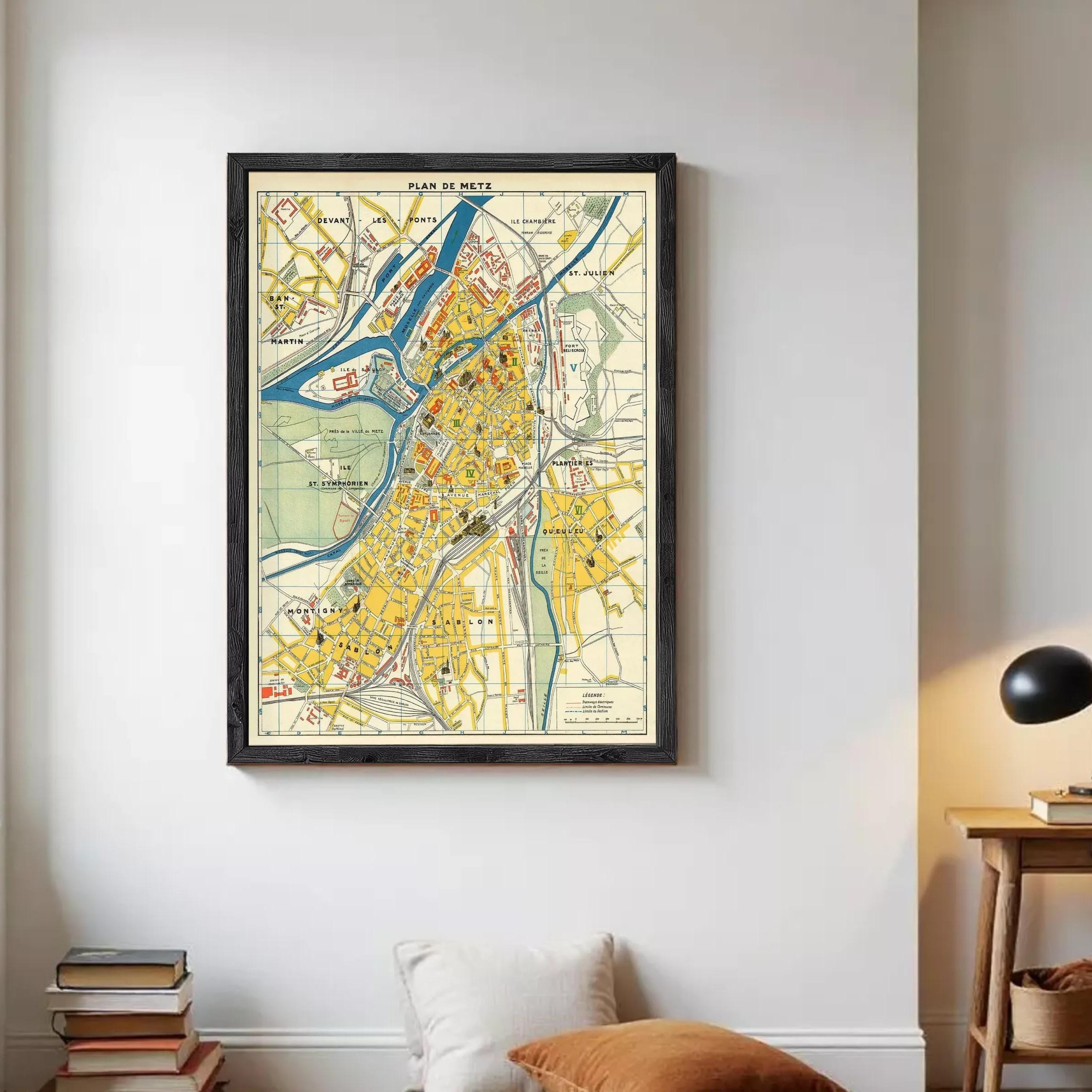 The image is a framed vintage map of a city, depicting various landmarks and streets in a detailed and colorful manner.