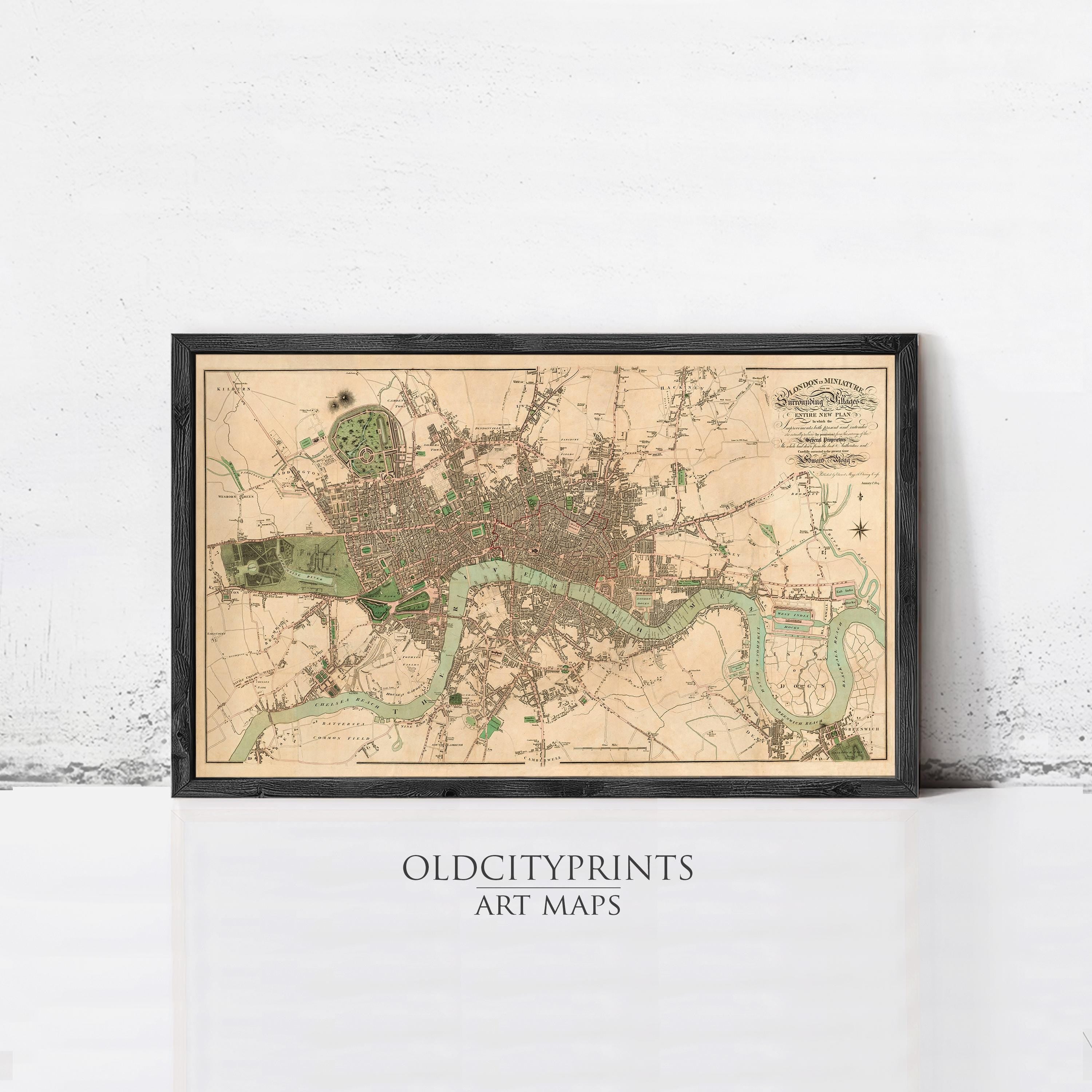 The image is a framed vintage map of London, England, depicting the city's streets, landmarks, and surrounding areas.