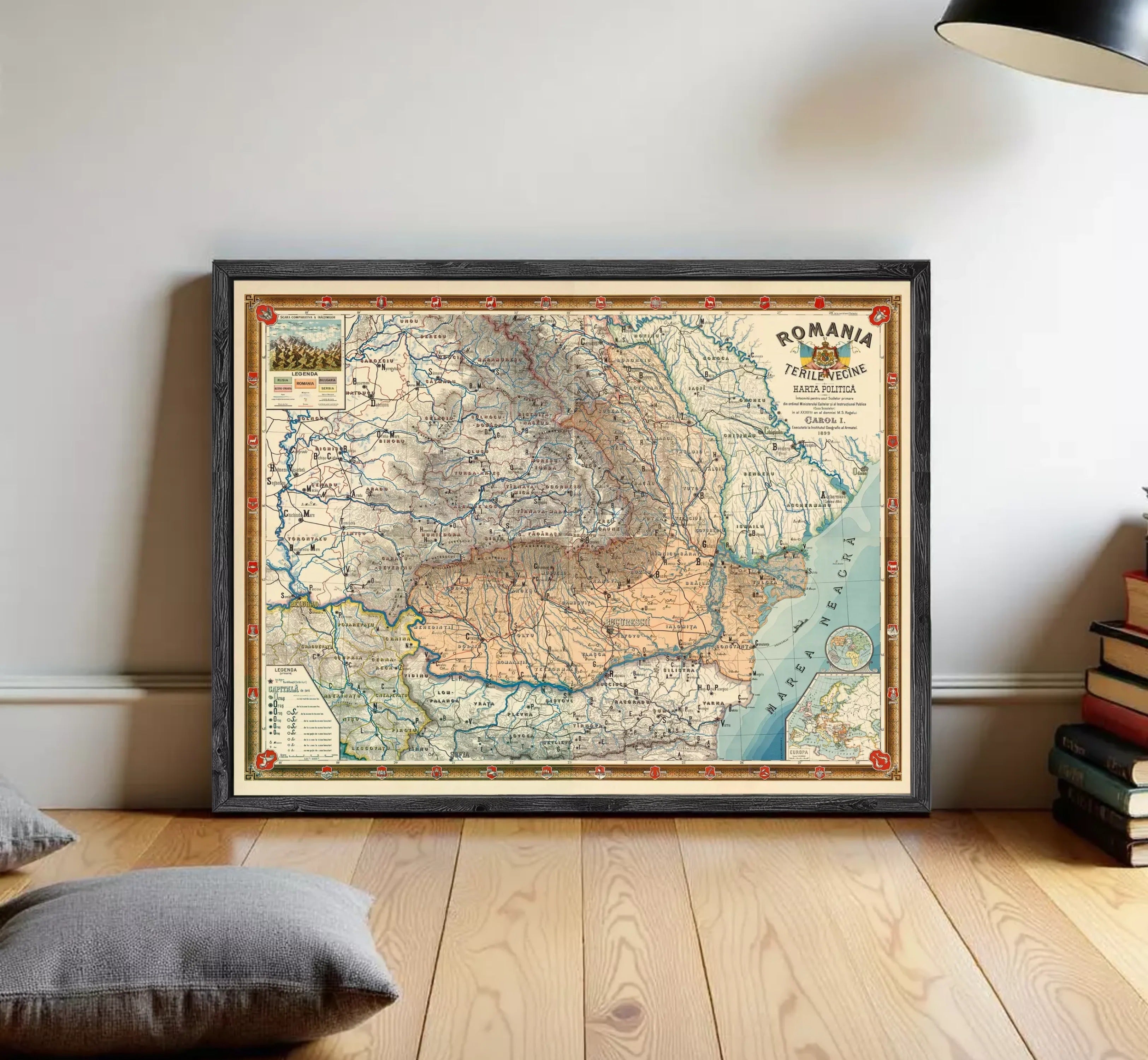 The image is a framed map of Romania, depicting the country's geographical layout and various regions.