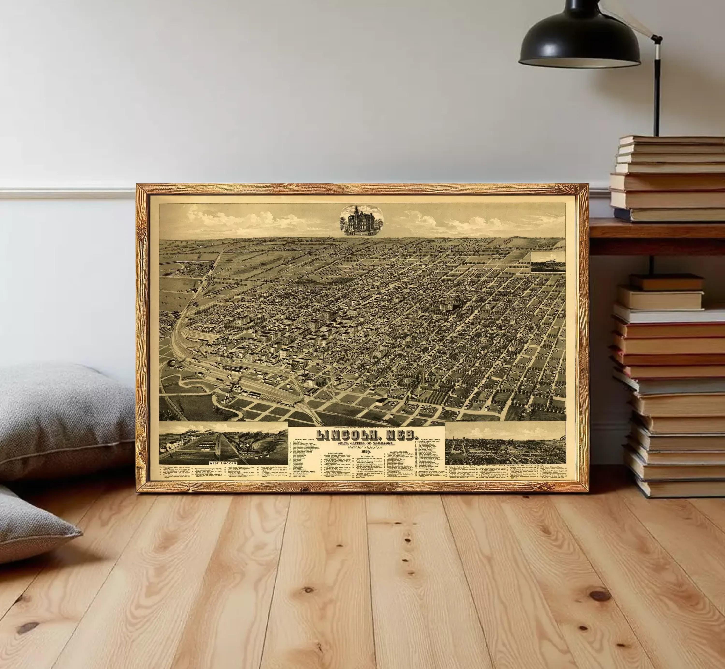 The image is a framed vintage map of a city, likely from the early 20th century, depicting a densely populated urban area with various landmarks and streets.