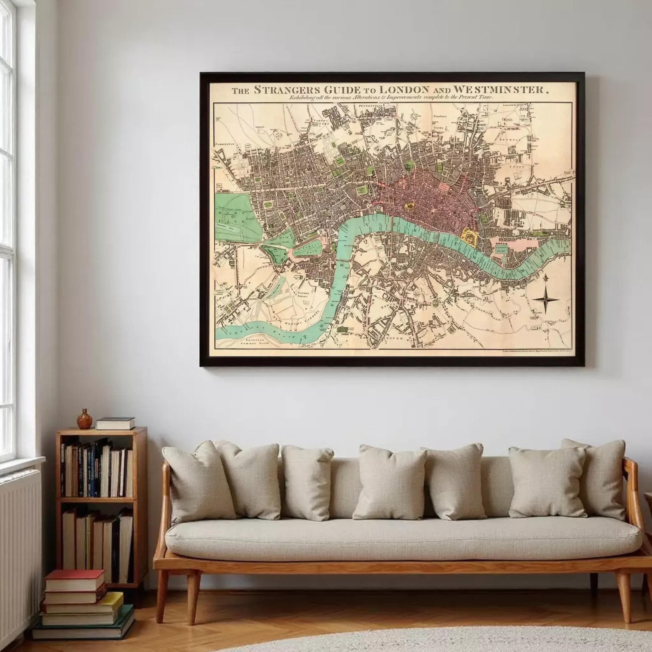 a large framed map of London and Westminster, with a cozy living room setting with a couch and bookshelf in the foreground.
