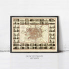 The image is a framed art print depicting a detailed map of Manchester, London, with various buildings and landmarks throughout the city.