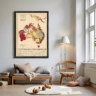 a living room with a large framed map of Australia hanging on the wall, a wooden bench, a wooden chair, and a lamp.