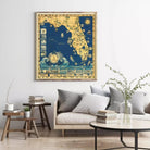 a large framed map of Florida hanging on a wall in a living room setting.