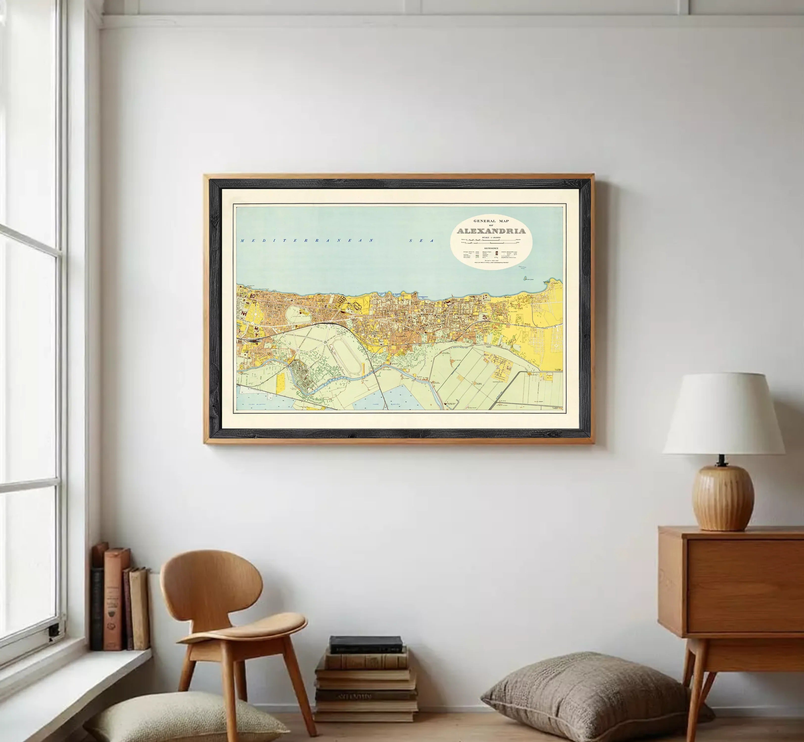 The image is a framed map of the city of Moscow, Russia, depicting the city's streets, landmarks, and surrounding areas.