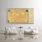 a large wall-mounted map of a city, with two white bean bag chairs positioned in front of it, creating a cozy seating area.