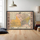 The image is a framed vintage map of a city, likely from the early 20th century, with various landmarks and streets depicted.