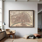 The image is a framed antique map of a city, depicting a detailed layout of the streets, buildings, and other urban features.