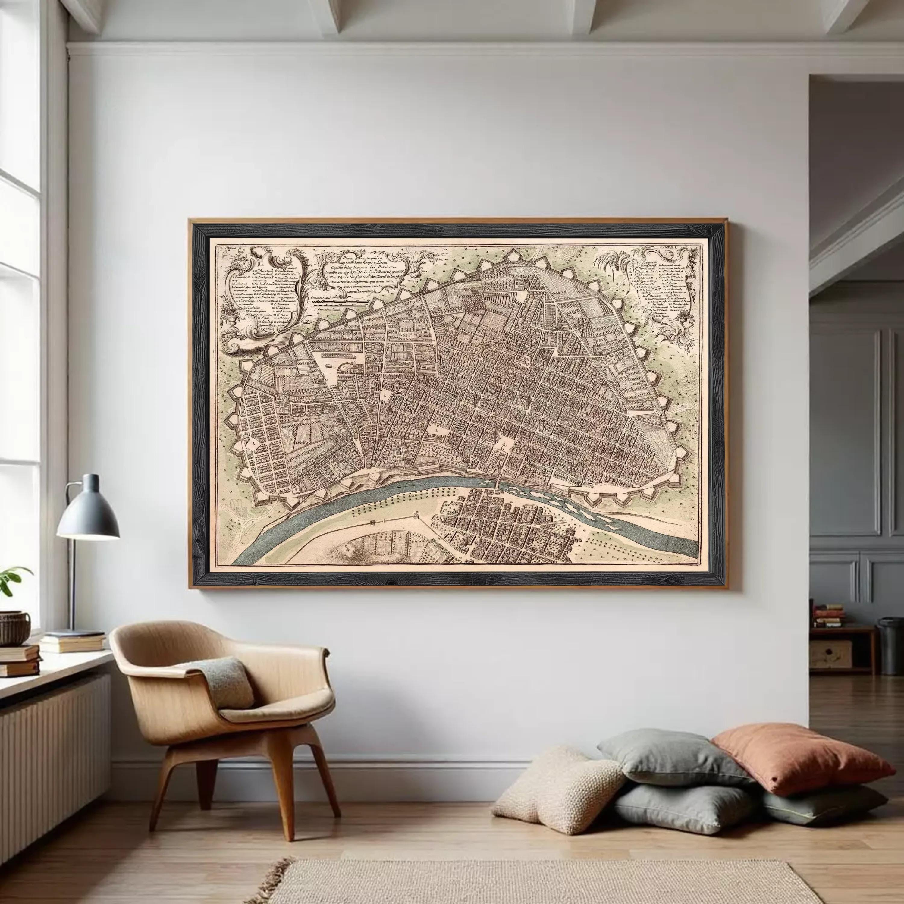 The image is a framed antique map of a city, depicting a detailed layout of the streets, buildings, and other urban features.