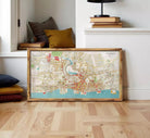 The image is a framed map of a city, likely showing a detailed layout of streets, landmarks, and other geographical features.