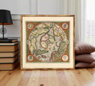The image is a framed vintage map of the world, depicting various countries and regions in a detailed and colorful manner.