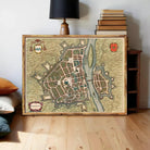 The image is a framed map of a city, likely from the 16th century, with a detailed and intricate illustration of the city's layout and surrounding areas.