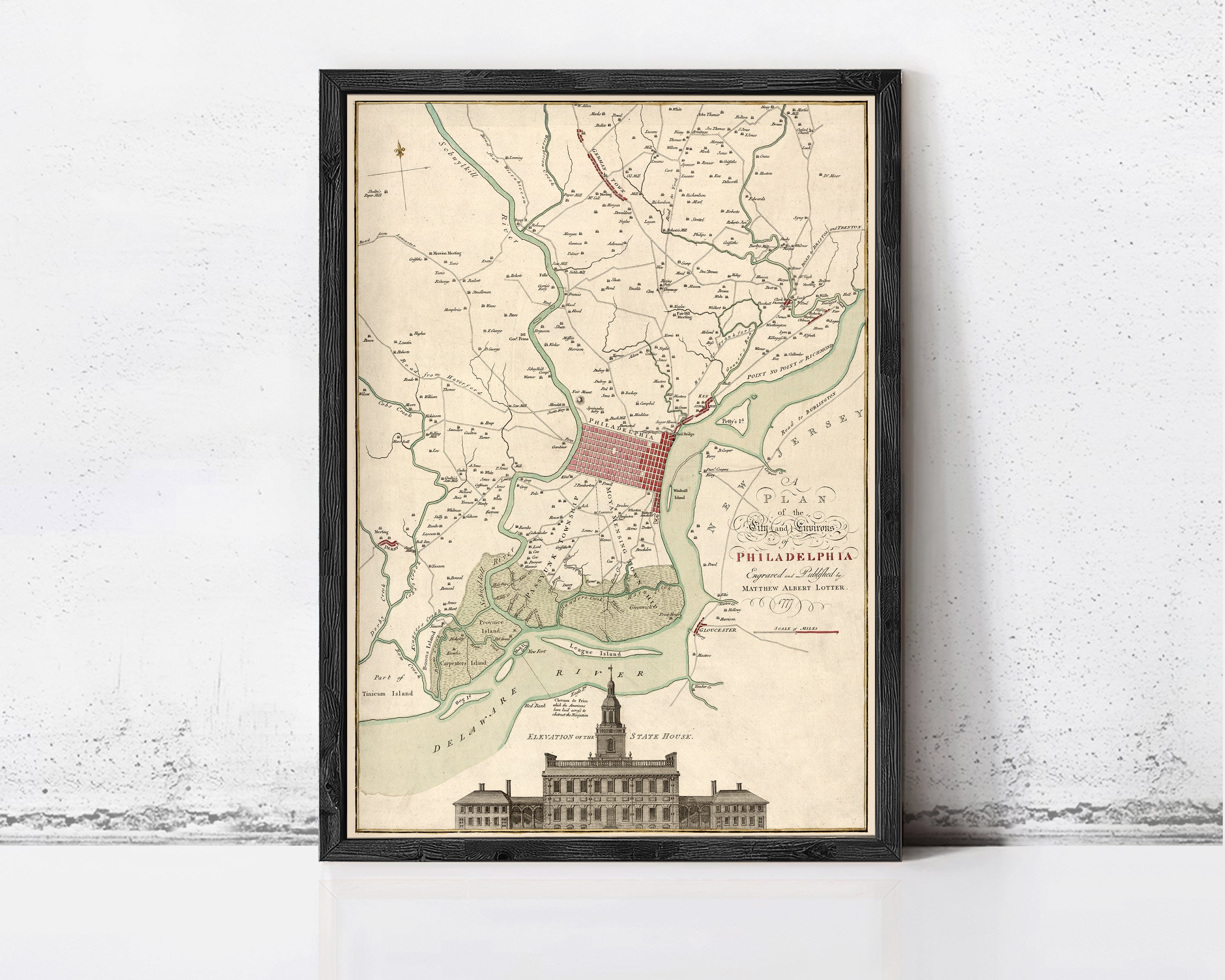 The image is a framed map of Philadelphia, Pennsylvania, depicting the city's layout and surrounding areas.