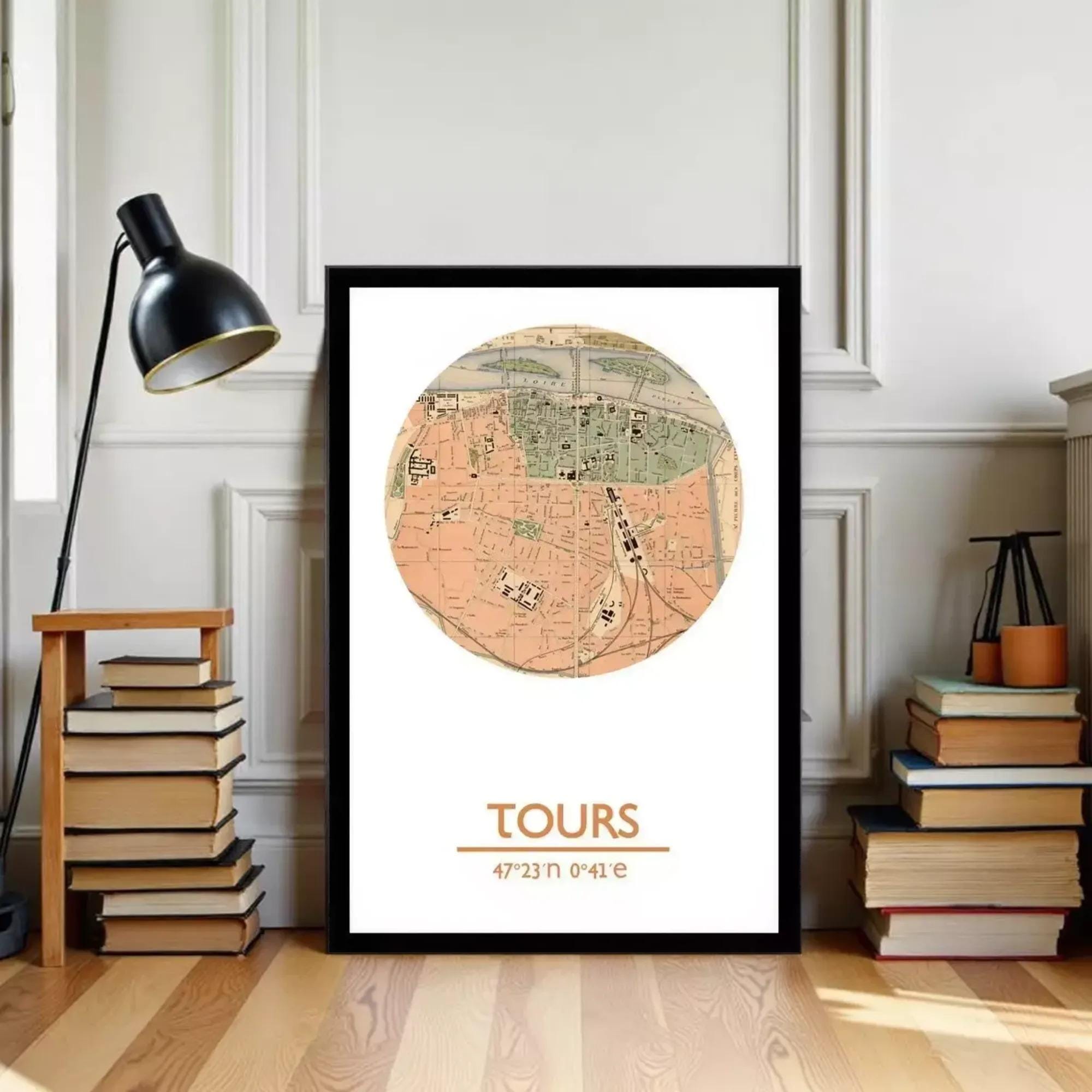 A framed vintage map of a city is displayed on a wall, with a stack of books and a lamp to the left.