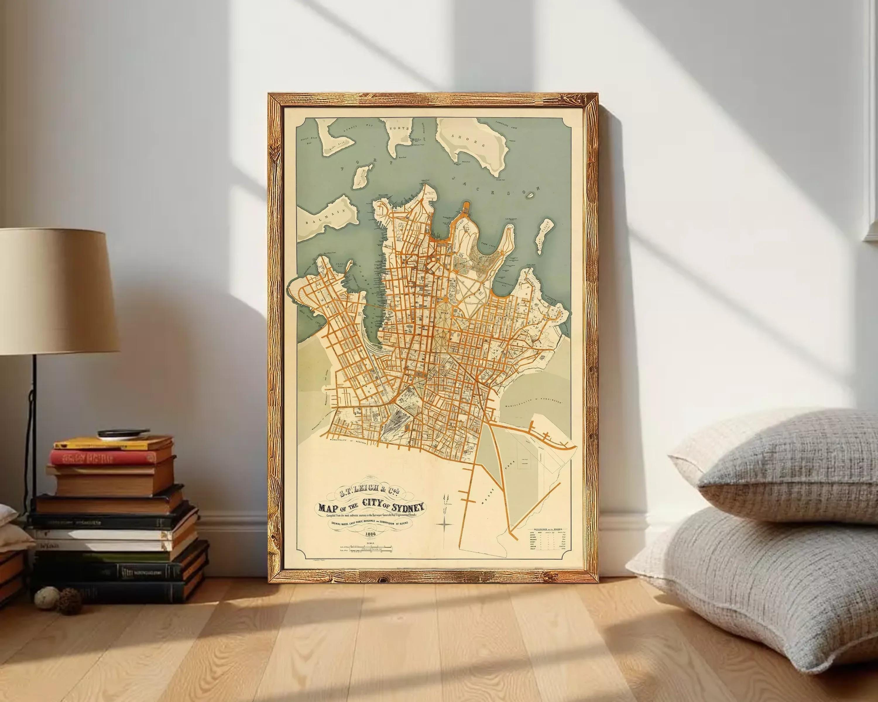The image is a framed vintage map of Sydney, Australia, depicting the city's streets and surrounding areas.