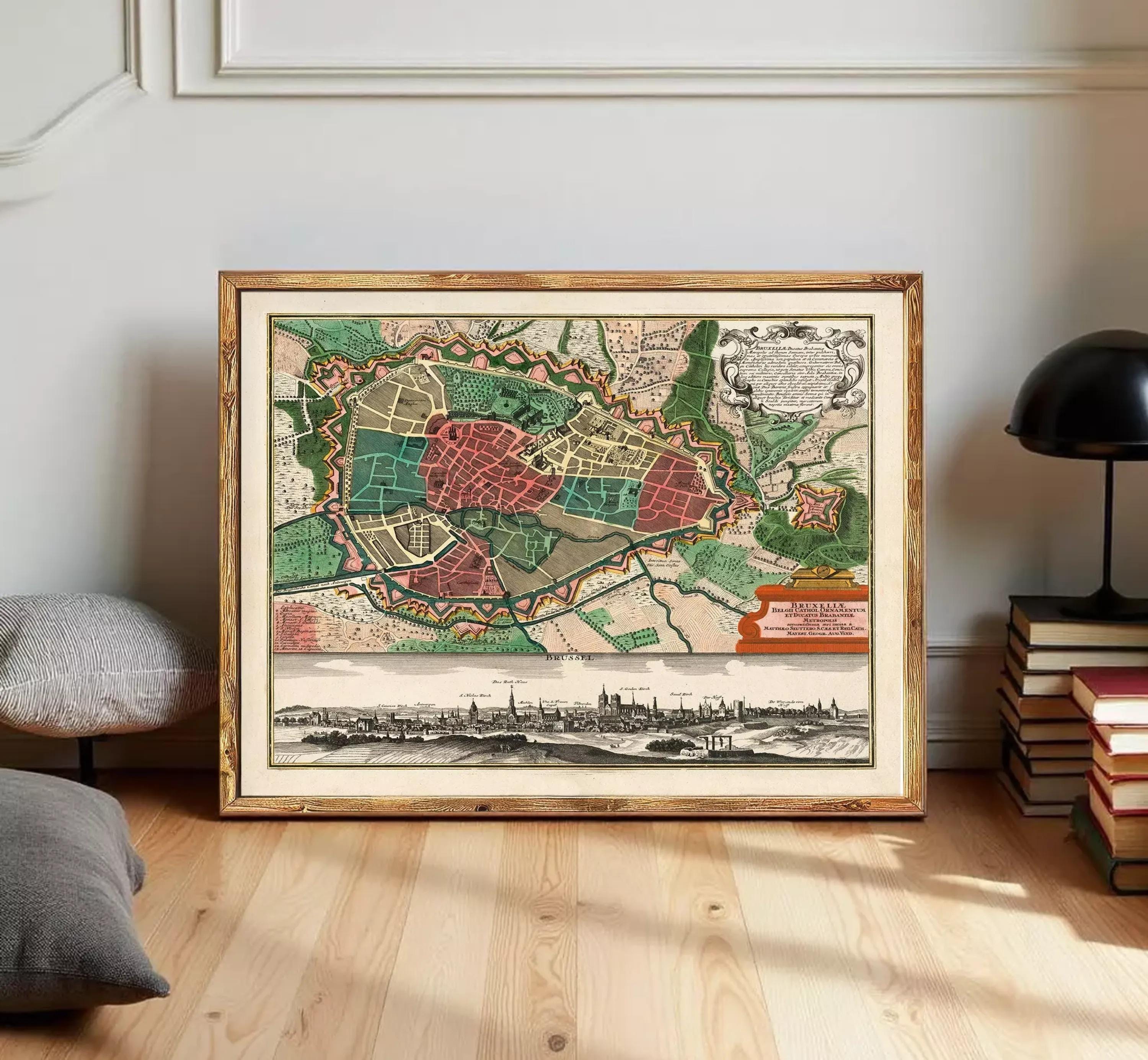 The image is a framed vintage map of a city, depicting a detailed layout of streets, buildings, and other urban features.