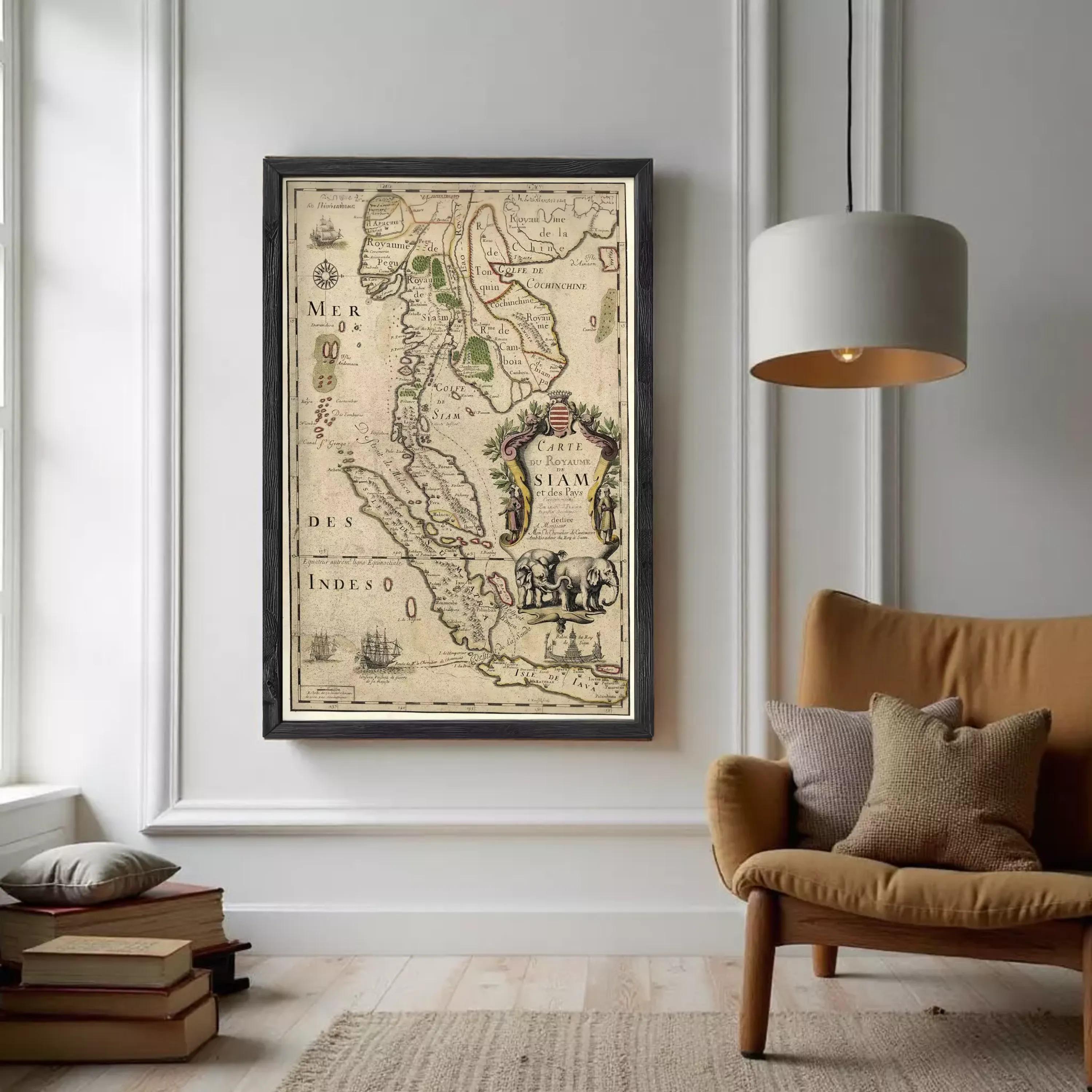 a framed map of Southeast Asia hanging on a wall in a living room.