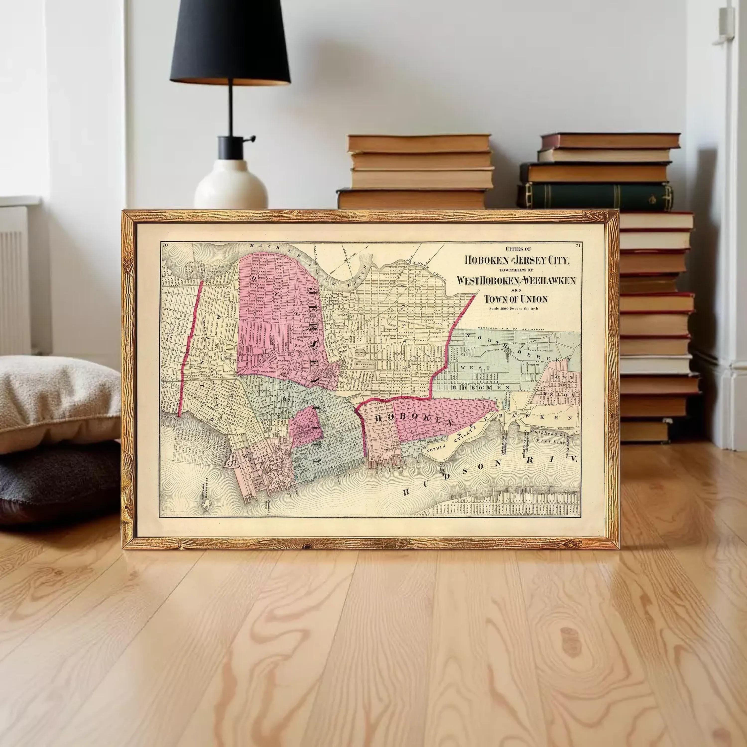 The image is a framed vintage map of Hoboken, Jersey City, New Jersey, depicting the city's layout and surrounding areas.