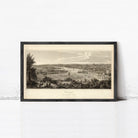 The image is a framed print depicting a cityscape with boats in the water, set against a cloudy sky.