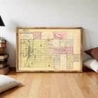 A framed map of the city of Lincoln, Illinois, with various landmarks and streets labeled.