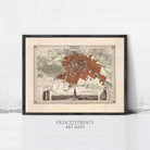 The image is a framed vintage map of a city, likely Paris, with a detailed and intricate design.