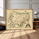 The image is a framed antique map of a region, likely from the 16th century, with detailed cartography and illustrations.