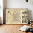 a large framed map of St. Paul, Minnesota, with a collage of smaller images depicting buildings and landmarks in the city.