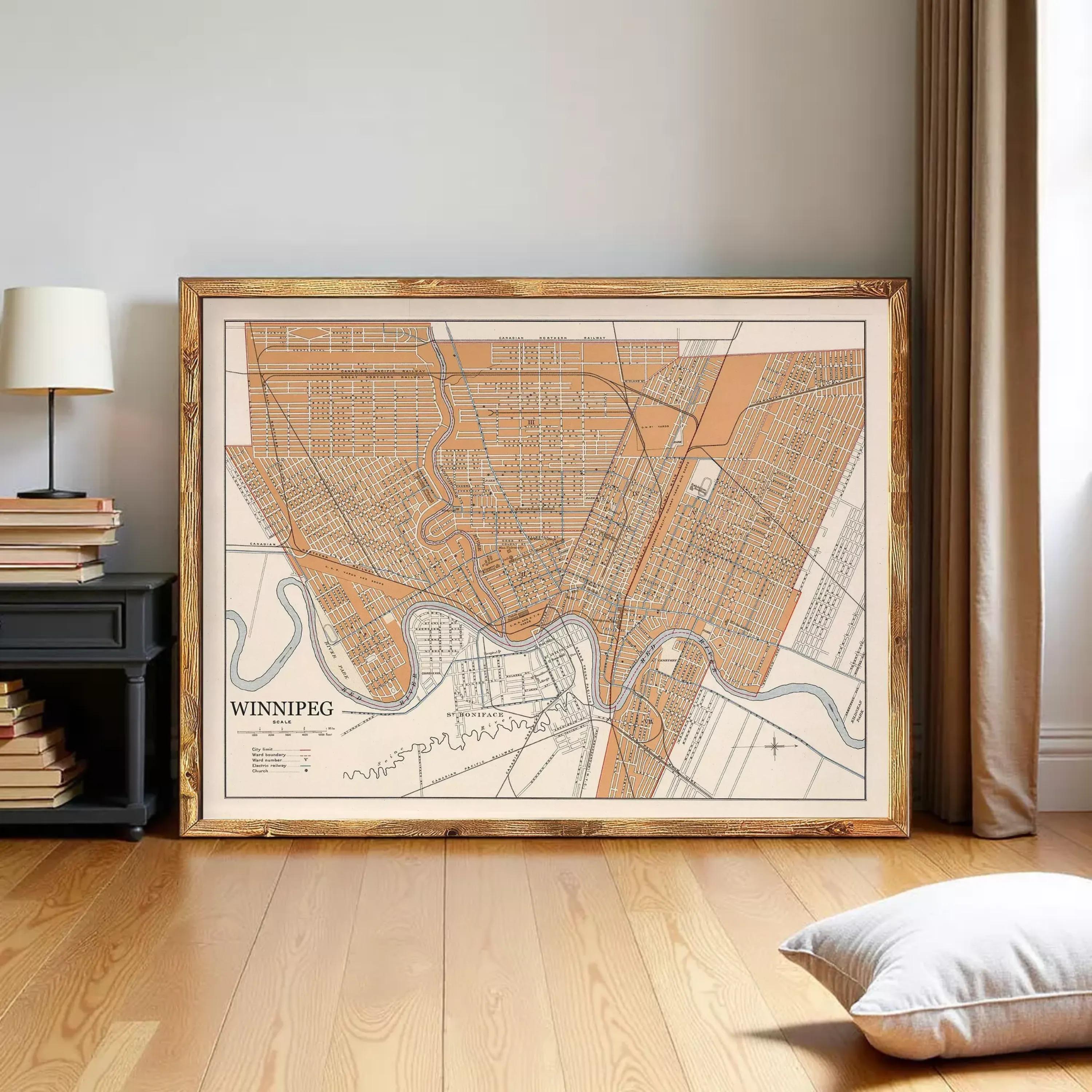 a large framed map of the city of Winnipeg, with a wooden floor and a lamp in the background.