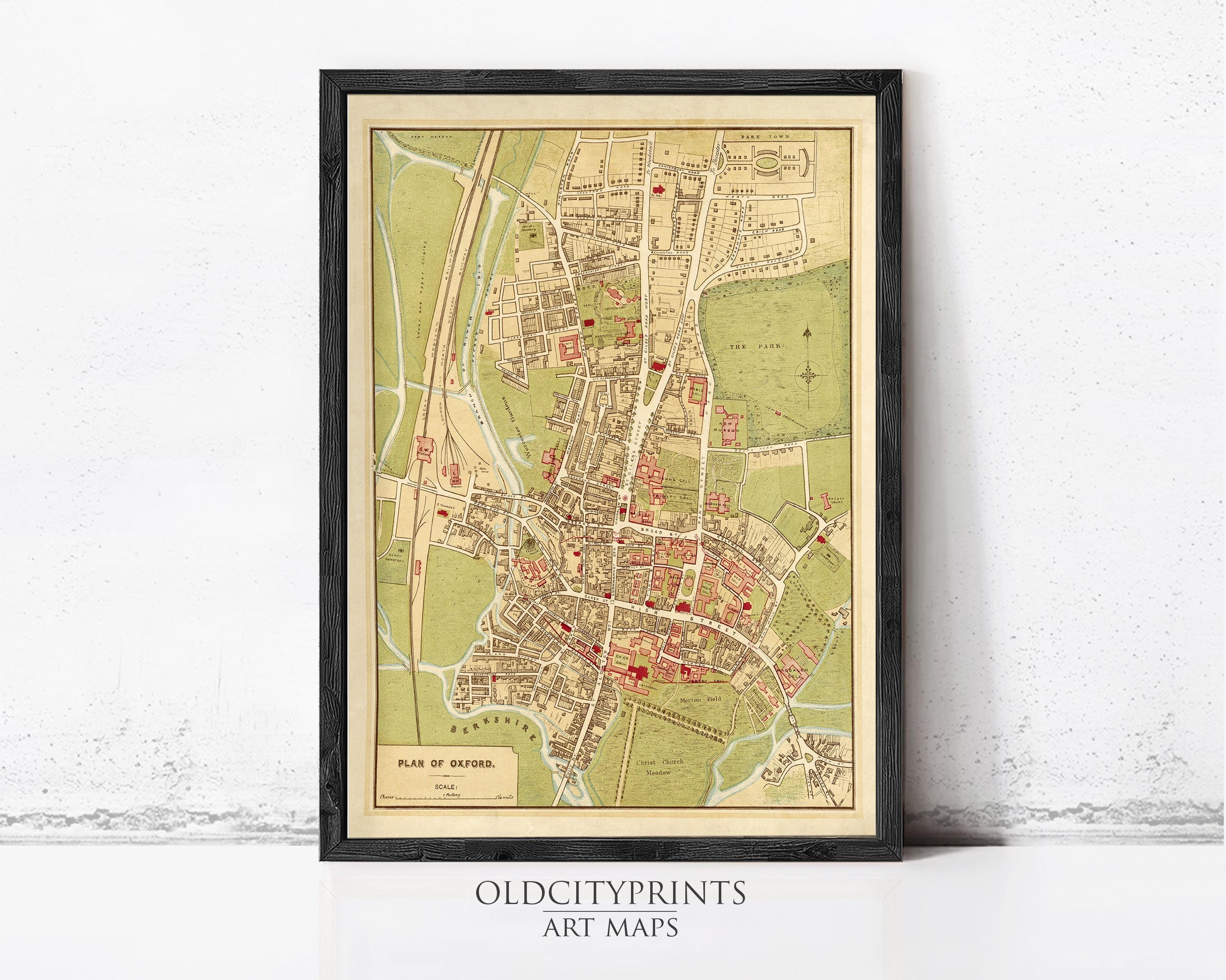 The image is a framed vintage map of a city, likely from the 19th century, with various landmarks and streets depicted.