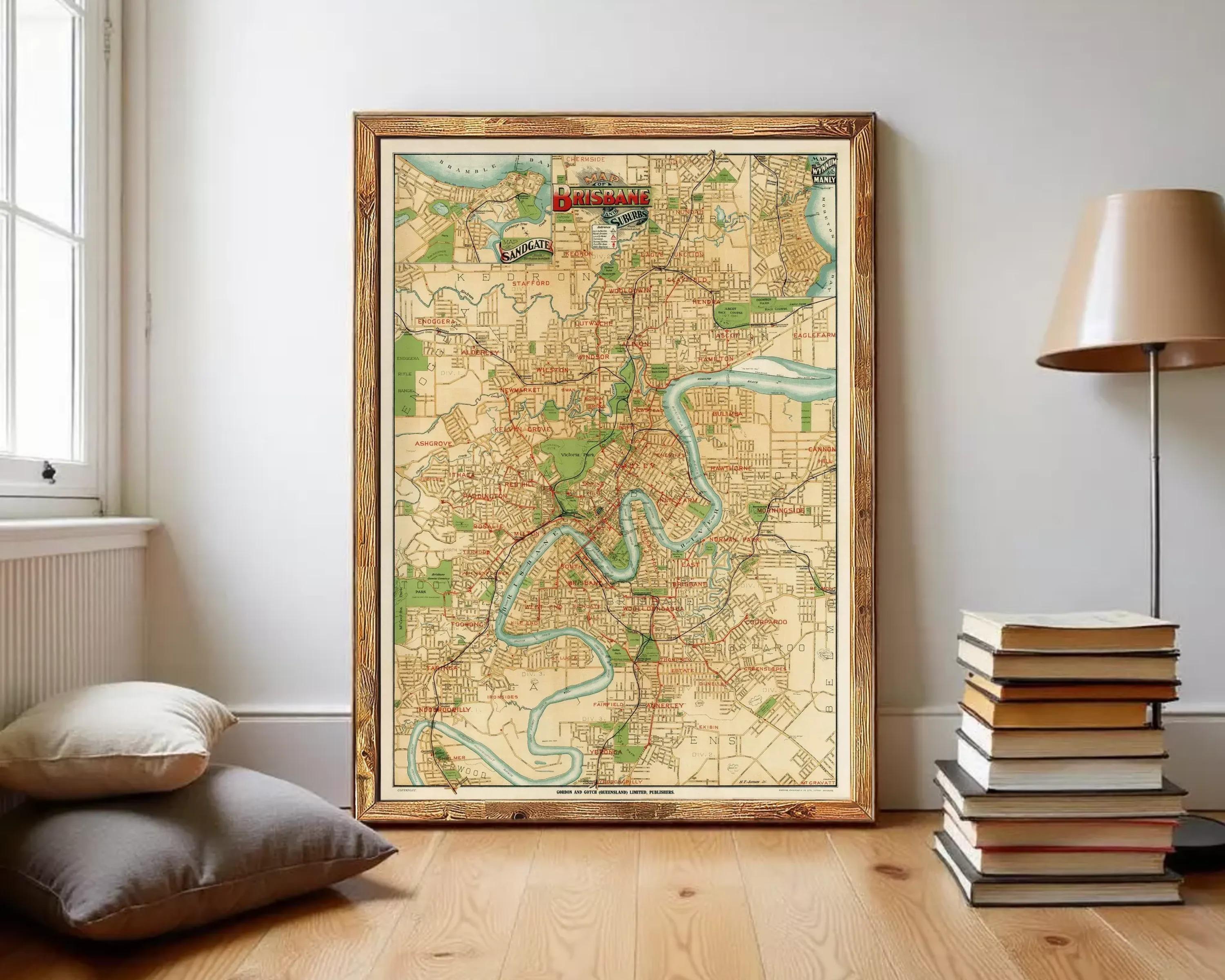 The image is a framed vintage map of the city of Brisbane, Australia, depicting the city's streets, landmarks, and surrounding areas.