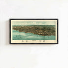 The image is a framed aerial map of a coastal city, depicting the city's layout, coastline, and surrounding areas.